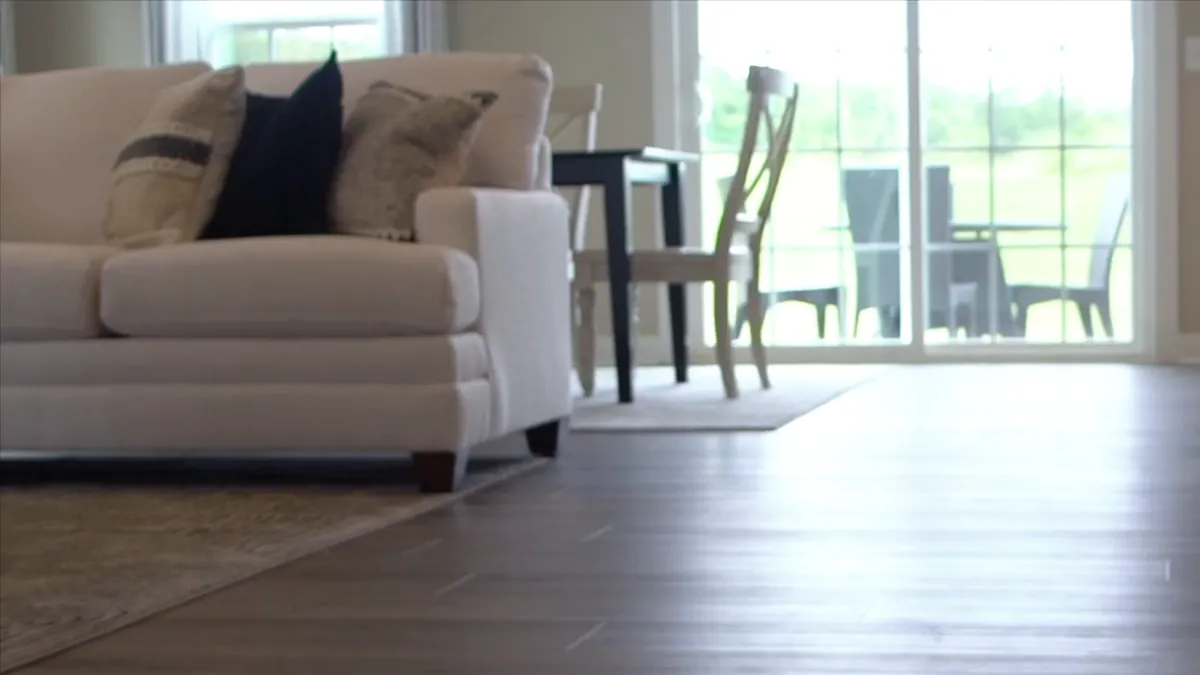 Floor-level view of a living room with plank flooring