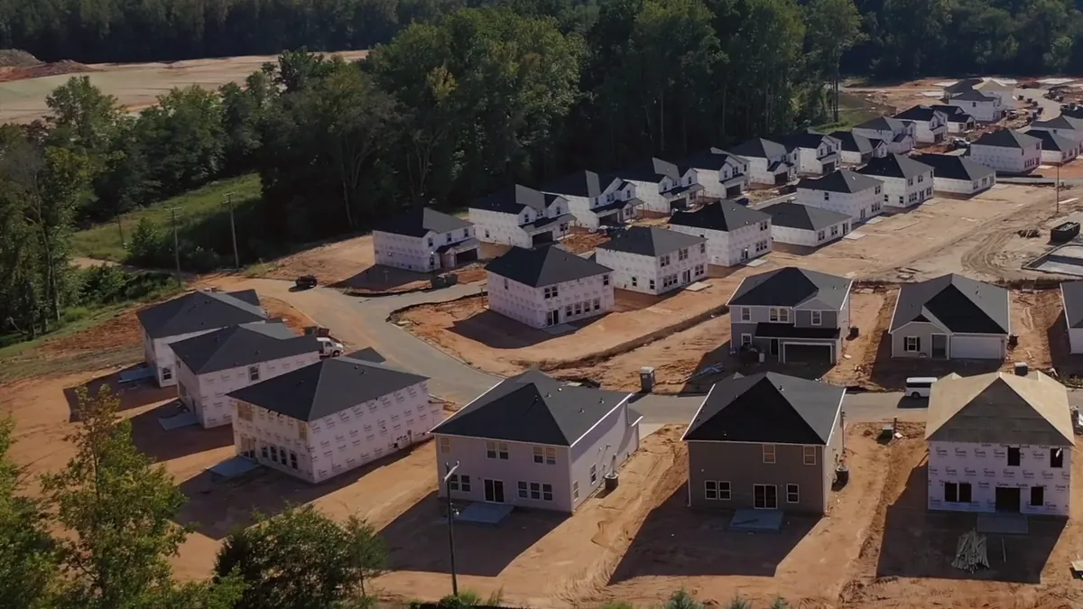 Cleared lots and new foundations in a community under construction