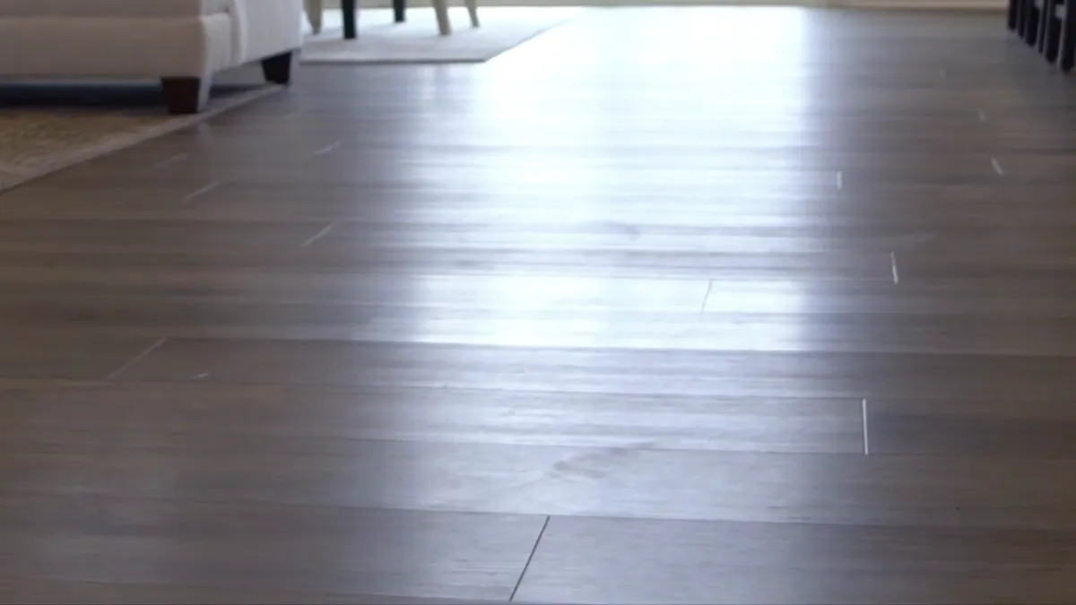 The grain of a wood-look plank floor