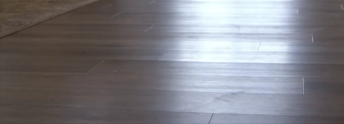 Close-up of a gray-brown plank floor