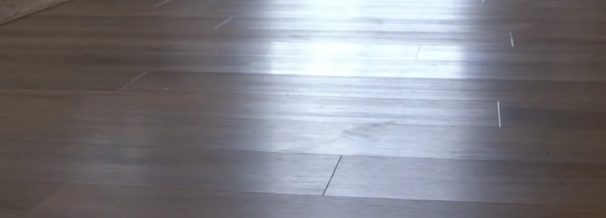 Close view of a wood-look plank floor surface